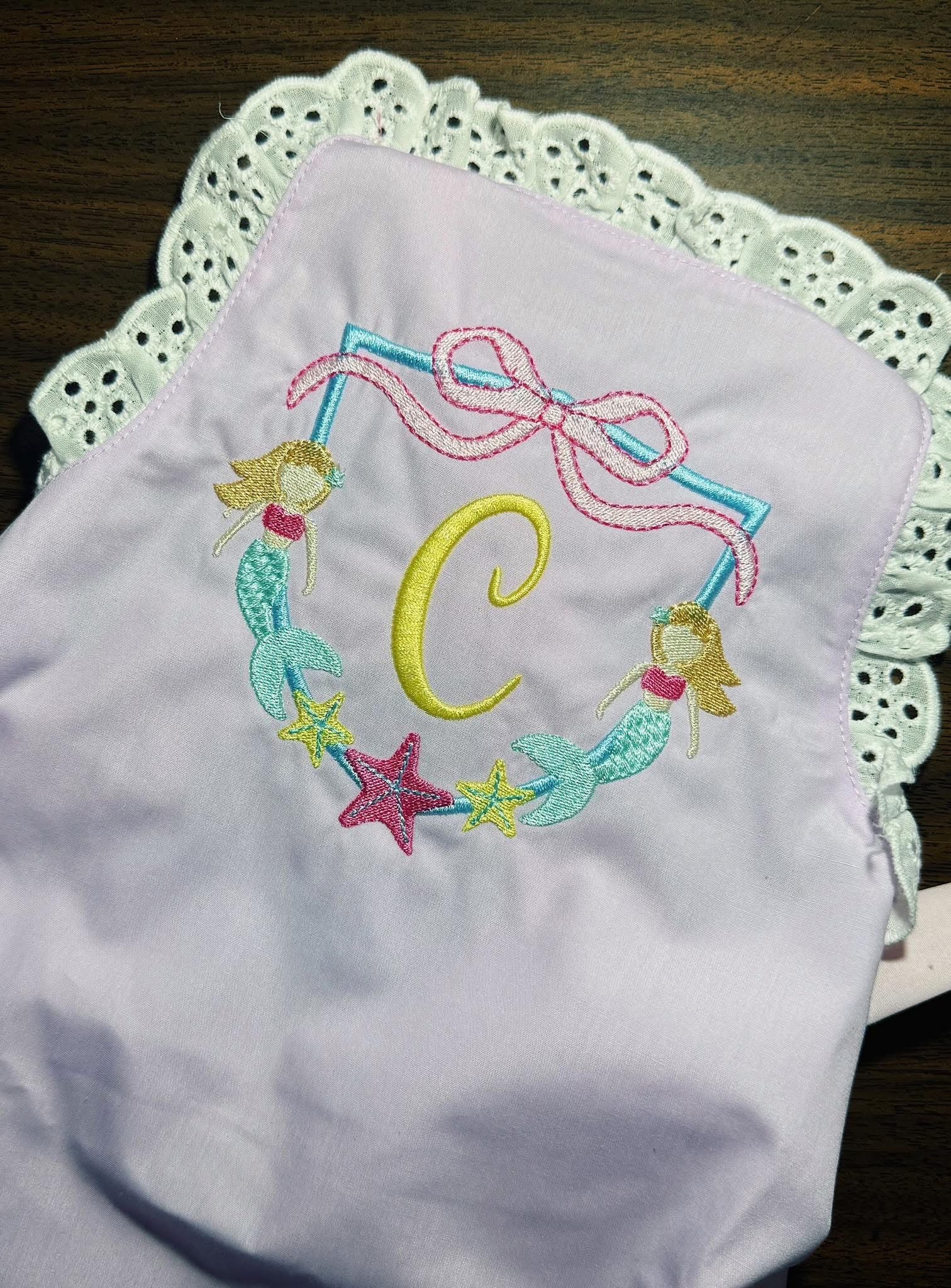Monogramed eyelet sun suit