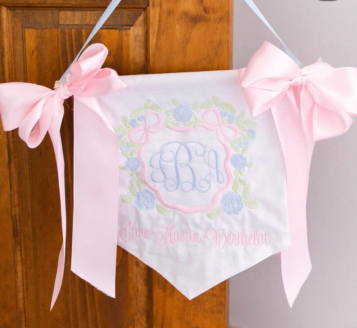 Personalized plain white baby banner with colored ribbon bow